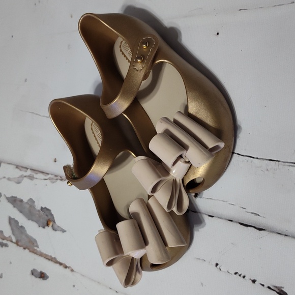 Mini Melissa Other - Mini Melissa bow shoes gold size7